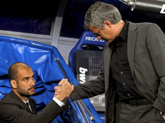 epa03198125 (FILE) Picture dated 16 April 2011 of FC Barcelona's head coach Pep Guardiola (L) shaking hands with Real Madrid's Portuguese head coach Jose Mourinho (R) before their Spanish Primera Division soccer match at the Santiago Bernabeu stadium in Madrid, Spain. Guardiola confirmed 27 April 2012, as expected, his decision to step down as coach of Barcelona. Guardiola, 41, took over at Barca in 2008 and guided Lionel Messi and company to the most successful spell