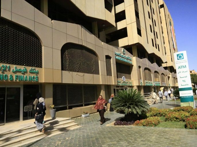 People walk past the Faisal Islamic Bank in Khartoum, Sudan January 12, 2016. Picture taken January 12, 2016. REUTERS/Mohamed Nureldin Abdallah