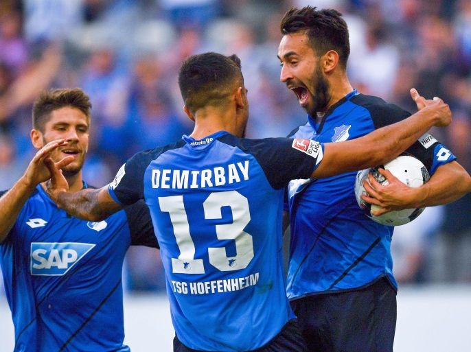 Hoffenheim's Lukas Rupp (R) celebrates with his teammate Kerem Demirbay (C) after scoring the 2-1 lead during the German Bundesliga soccer match between TSG 1899 Hoffenheim and FC Schalke 04 at Rhein-Neckar-Arena in Sinsheim, Germany, 25 September 2016. EPA/UWE ANSPACH (EMBARGO CONDITIONS - ATTENTION: Due to the accreditation guidlines, the DFL only permits the publication and utilisation of up to 15 pictures per match on the internet and in online media during the match.)