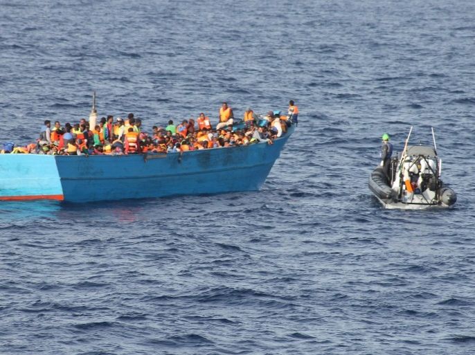 A handout photograph made avaiable by the Irish Defence Forces on 22 ctober 2016 showing crew members of the The Irish Naval Service, Samuel Beckett-class offshore patrol vessel (OPV), the LE Samuel Beckett as they rescue migrants in the Mediterranean 36 Nautical Miles North East of Tripoli, Libya, on 21 October 2016/. The Irish Defence Forces report that the ship has rescued 772 migrants during the complex search and rescue operation. The LÉ Samuel Beckett departed Naval Service Headquarters in Haulbowline, Cork, Ireland, to assist the Italian Authorities in the humanitarian search and rescue operations in the Mediterranean on 23 September 2016. EPA/IRISH DEFENCE FORCES / HANDOUT