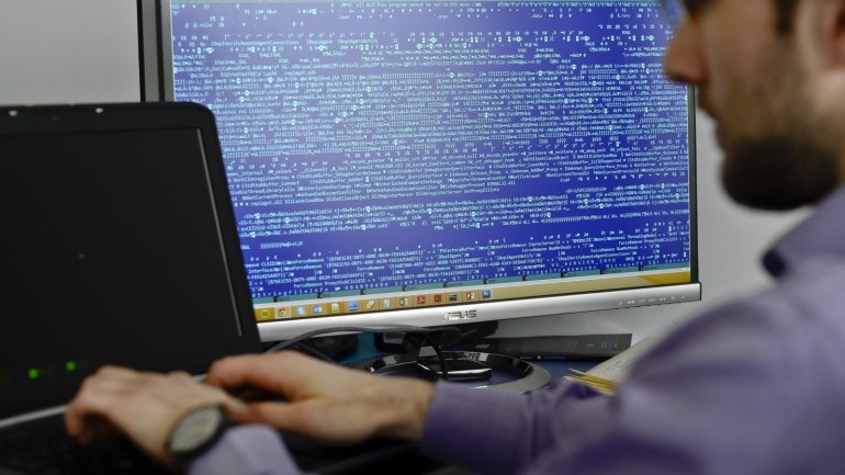 In this picture taken on March 5, 2015, an employee works at the headquarters of Bitdefender, a leading Romanian cyber security company, in Bucharest, Romania. Romania, the eastern European country, known more for economic disarray than technological prowess, has become one of the leading nations in Europe in the fight against hacking. The reason: the country’s own battle against Internet renegades and a legacy of computing excellence stemming from Communist dictator Nicolae Ceausescu’s regime. (Octav Ganea/ Mediafax via AP) ROMANIA OUT