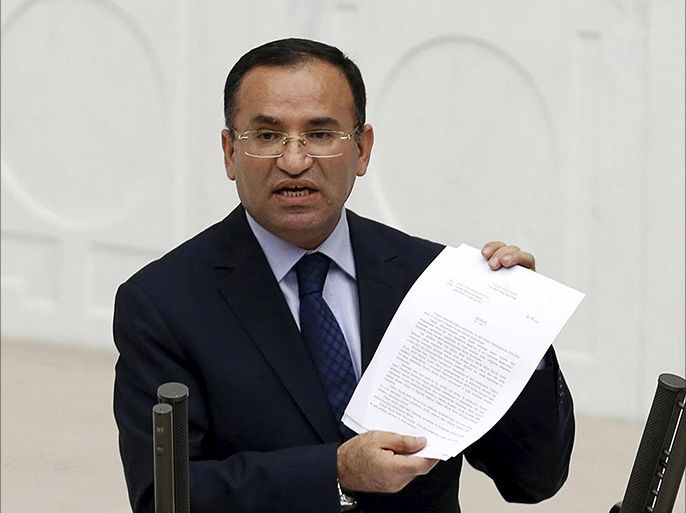 Justice Minister Bekir Bozdag addresses the Turkish Parliament during a debate in Ankara in this March 19, 2014 file photo. Turkey will work on new rules to strip citizenship from Turks found to be supporting terrorism, Bozdag said on Wednesday, a day after President Tayyip Erdogan called for the measure. REUTERS/Umit Bektas/Files