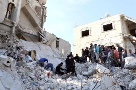 Civil defense members and civilians search for survivors under the rubble of a site hit by overnight airstrikes in the town of Kafr Takharim, in Idlib Governorate, Syria October 24, 2016. REUTERS/Ammar Abdullah
