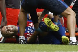 Barcelona's midfielder Andres Iniesta reacts in pain after picking up an injury during the Spanish Primera Division match between Valencia FC and Barcelona FC held at the Mestalla stadium in Valencia, Spain, 22 October 2016.