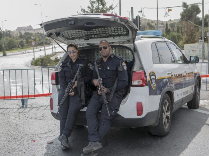 Israeli Police, guarding a blocked road in Jerusalem, Israel, 12 October 2016, next to the Israeli police headquarter during the Jewish holiday of Yom Kippur. On Yom Kippur the entire country comes to a standstill as people fast and spend much of the day in prayer.
