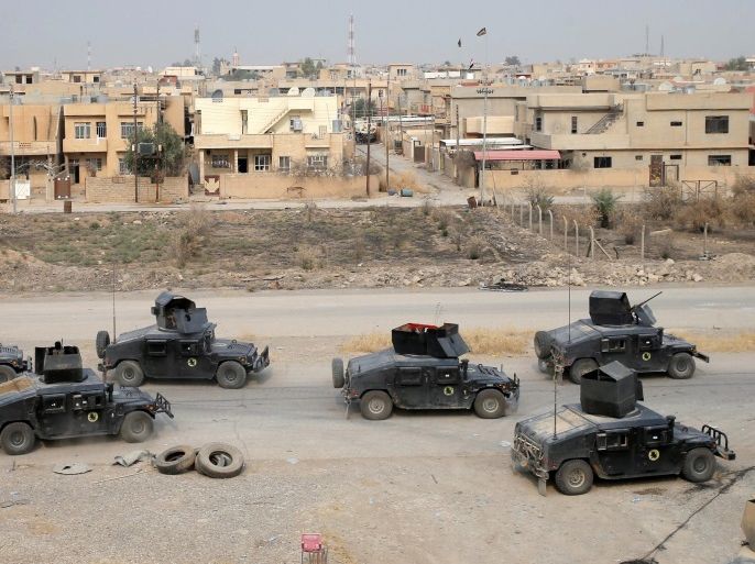 Iraqi special forces soldiers drive armoured vehicles Bartella, east of Mosul, Iraq October 24, 2016. REUTERS/Goran Tomasevic