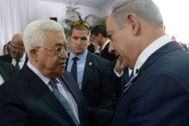 Israeli Prime Minister Benjamin Netanyahu shakes hands with Palestinian President Mahmoud Abbas (L) during the funeral of former Israeli President Shimon Peres in Jerusalem September 30, 2016. Amos Ben Gershom/Government Press Office (GPO)/Handout via REUTERS ATTENTION EDITORS - THIS IMAGE HAS BEEN SUPPLIED BY A THIRD PARTY. IT IS DISTRIBUTED, EXACTLY AS RECEIVED BY REUTERS, AS A SERVICE TO CLIENTS. FOR EDITORIAL USE ONLY. TPX IMAGES OF THE DAY