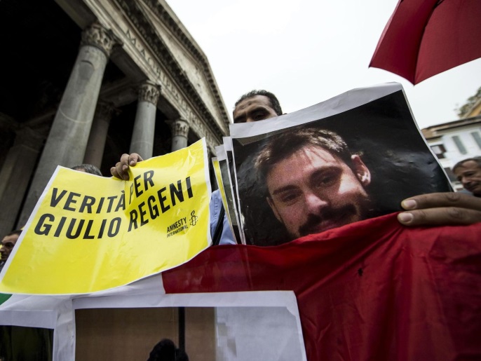 People carry signs reading 'Truth for Giulio Regeni' as they take part in a tochlight vigil to remember Giulio Regeni, an Italian student who was tortured and murdered in Cairo, Egypt, in front of the Pantheon, in the centre of Rome, Italy, 25 July 2016. Regeni's mutilated body was found on 03 February 2016.