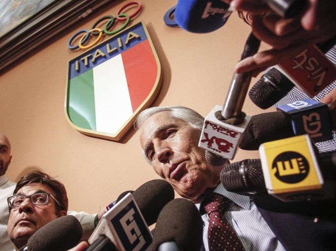 Italian Olympic Committee (CONI) President Giovanni Malago (C) holds a press conference in Rome, Italy, 21 September 2016, following the announcement of Rome's Mayor Virginia Raggi to drop the bid to host the Olympic Games in 2024.