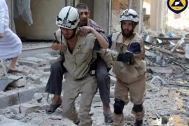 An undated handout picture made available by the Syria Civil Defence volunteer organization on 07 October 2016 showing a volunteer carrying an injured man in Aleppo, Syria. Syria Civil Defence is a volunteer group, also known as the White Helmets, that consists of over three thousand local volunteers spread across areas of conflict around Syria. In the past three years they saved over 62 thousand Syrian lives, while losing 145 volunteer during airstrikes and 430 others injured. EPA/SYRIA CIVIL DEFENCE / HANDOUT