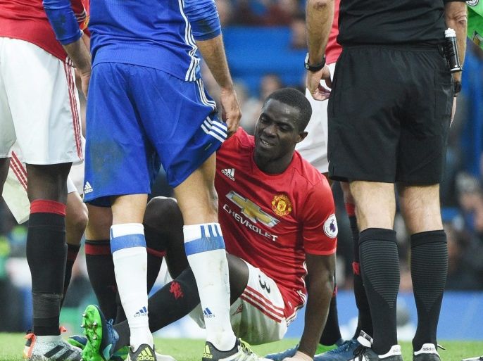 Manchester United Eric Bailly is being helped as it was reported that he has suffered a 'knee injury' during the English Premier League game between Chelsea and Manchester United at Stamford Bridge in London, Britain, 23 October 2016. EPA/FACUNDO ARRIZABALAGA EDITORIAL USE ONLY. No use with unauthorized audio, video, data, fixture lists, club/league logos or 'live' services. Online in-match use limited to 75 images, no video emulation. No use in betting, games or single club/league/player publications