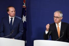 Australian Prime Minister Malcolm Turnbull (R) and Immigration and Border Protection Minister Peter Dutton (L) speak during a press conference in Sydney, Australia, 30 October 2016. Turnbull and Dutton announced that the Migration Act will be amended to ensure that asylum seekers who try to come to Australia by boat are forbidden from ever entering the country. EPA/PAUL MILLER AUSTRALIA AND NEW ZEALAND OUT