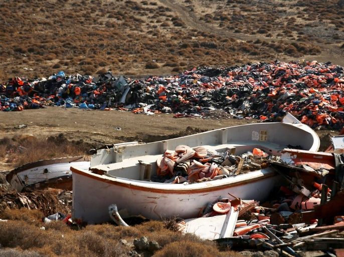 Lifejackets are seen inside a wrecked boat used by refugees and migrants to cross part of the Aegean Sea from Turkey to Greece at a garbage dump site of thousands of lifejackets, near the town of Mithymna (also known as Molyvos) on the island of Lesbos, Greece, October 5, 2016. REUTERS/Alkis Konstantinidis