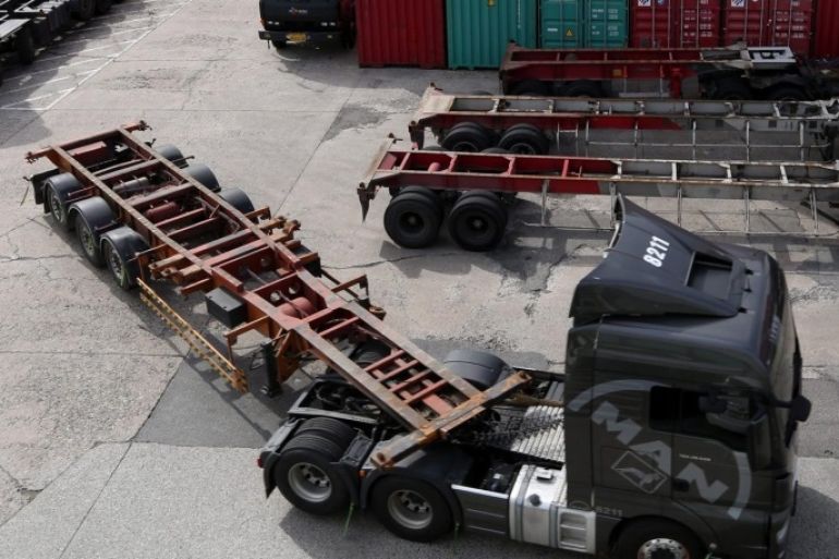 A unionized cargo truck parks during a rally against South Korean government's transportation policy at the Uiwang Inland Container Depot in Uiwang, South Korea, 10 October 2016.