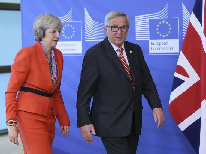 British Prime Minister Theresa May is welcomed by European Commission President Jean-Claude Juncker (R) prior to a meeting at EU commission on the side of the European Summit in Brussels, Belgium, 21 October 2016. EU Leaders meet on 20 and 21 October to discuss migration, trade and Russia, including its role in Syria, it will be also the first summit attended by new British Prime Minister Theresa May.