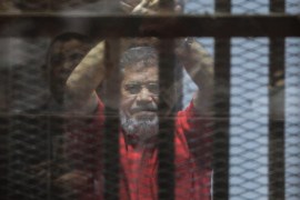 YEARENDER 2016 JUNEOusted Egyptian President Mohamed Morsi looks on during a trial session on charges of espionage in Cairo, Egypt, 18 June 2016. A court sentenced ousted president Mohamed Morsi to life in prison as well as a 15-year prison sentence over charges of allegedly leaking classified documents related to national security to Qatar in exchange for payments. The court also confirmed death sentences against six co-defendants in the case. EPA/MOHAMED HOSSAM *** L