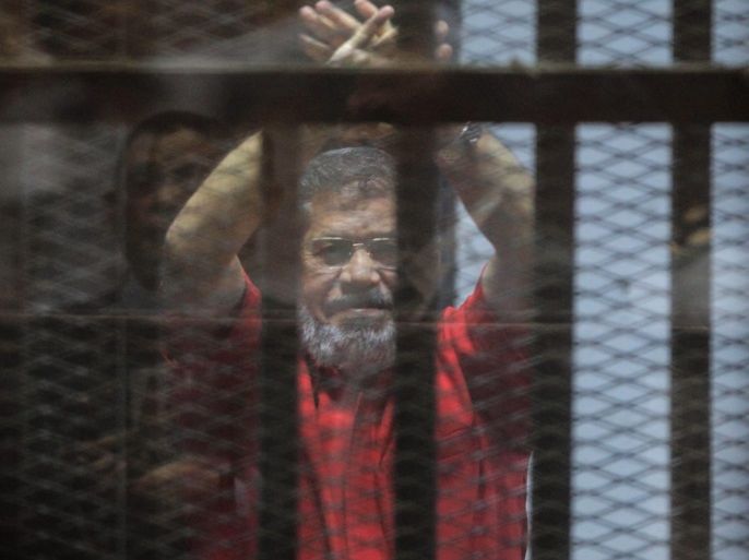YEARENDER 2016 JUNEOusted Egyptian President Mohamed Morsi looks on during a trial session on charges of espionage in Cairo, Egypt, 18 June 2016. A court sentenced ousted president Mohamed Morsi to life in prison as well as a 15-year prison sentence over charges of allegedly leaking classified documents related to national security to Qatar in exchange for payments. The court also confirmed death sentences against six co-defendants in the case. EPA/MOHAMED HOSSAM *** L