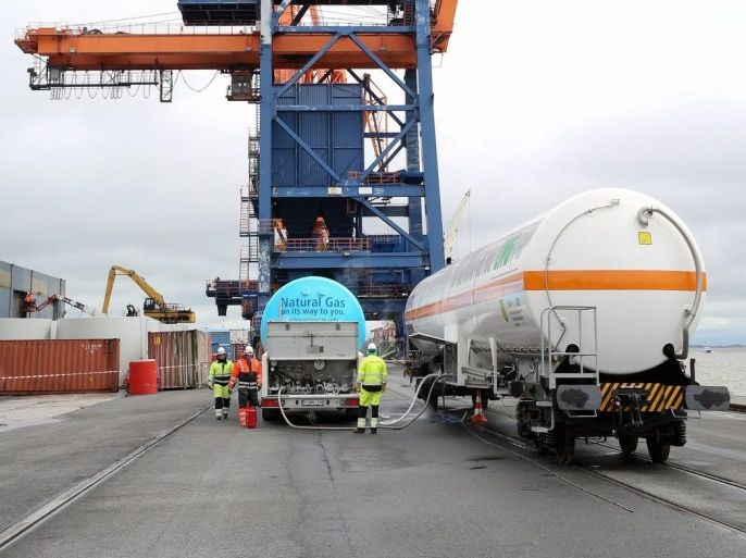 Liquefied natural gas is loaded onto a tank wagon (R) at the Elbe Port in Brunsbuettel, Germany, 25 April 2016. This is the first time that a tank wagon is loaded with liquefied natural gas at the port in Brunsbuettel.