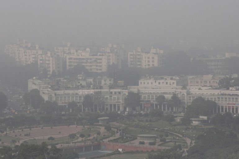 An aerial view of the Connaught Place area of New Delhi, India, as it is surrounded by smog on 08 December 2015. According to the World Health Organization (WHO), Delhi is one of the most polluted cities in the world. Pollution levels for fine particulate matter or PM2.5 at the Anand Vihar monitoring station in New Delhi was 448 micrograms last week while WHO recommends that people are not exposed to PM2.5 levels over 10 micrograms averaged over a year, or 25 microgams over any 24-hour period, as small particles can get deep into the lungs and even enter the bloodstream. To curb the pollution in the city, the Delhi government has proposed that private vehicles with odd or even registration number would be allowed to run on alternate days.