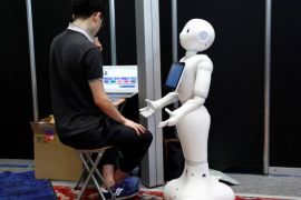 A man sets up a SoftBank humanoid robot known as Pepper as he prepares for Pepper World 2016 Summer, ahead of its opening on Thursday, in Tokyo, Japan, July 20, 2016. REUTERS/Kim Kyung-Hoon