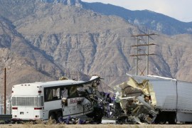 Investigators confer at the scene of a mass casualty bus crash on the westbound Interstate 10 freeway near Palm Springs, California, October 23, 2016. REUTERS/Sam Mircovich TPX IMAGES OF THE DAY