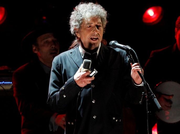 Singer Bob Dylan performs during a segment honoring Director Martin Scorsese, recipient of the Music+ Film Award, at the 17th Annual Critics' Choice Movie Awards in Los Angeles January 12, 2012. REUTERS/Mario Anzuoni/File Photo