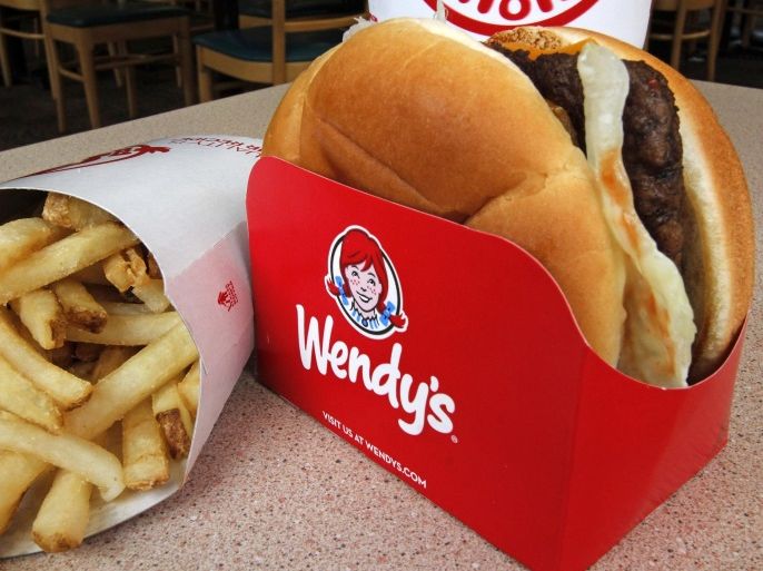 In this Monday, May 6, 2013, photo, a Wendy's single with cheese large combo meal is photographed at a Wendy's restaurant in Mt. Lebanon, Pa. The Wendy's Co. reports quarterly financial results before the market opens on Wednesday, May 8, 2013.