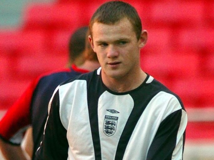 123epa000266135 (FILES) A picture dated Sunday 20 June 2004 of England's soccer player Wayne Rooney during an English training session in Lisbon's Luz Stadium in Portugal. Manchester United announced Tuesday 31 August 2004 that it has reached 'outline agreement' to sign Rooney from Everton. United is reported to be paying around 25 million pounds (37 million euros) for the player, subject to medical tests. EPA/GEORGI LIKOVSKI