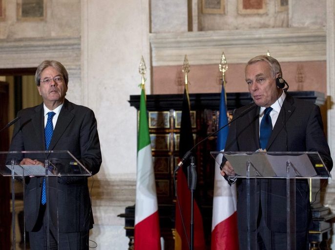 Italian Foreign Minister Paolo Gentiloni (C) with French Foreign Minister Jean-Marc Ayrault (R) and German Foreign Minister Frank-Walter Steinmeier (L) answer to journalists' questions during a joint news conference following their trilateral meeting at the Villa Madama, in Rome, Italy, 12 October 2016.