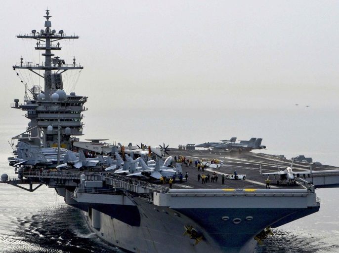 The aircraft carrier USS Theodore Roosevelt (CVN 71) sails in the Arabian Sea, in this U.S. Navy photo taken April 16, 2015. The Roosevelt and its escort ship the guided-missile cruiser USS Normandy (CG 60) will join seven other U.S. warships in the waters near Yemen, which is torn by civil strife as Iranian-backed Houthi rebels battle forces loyal to the U.S.-backed president. Picture taken April 16, 2015. REUTERS/U.S. Navy/Mass Communication Specialist Seaman Ann