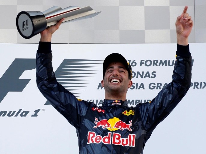 Formula One - F1 - Malaysia Grand Prix - Sepang, Malaysia- 2/10/16 Red Bull's Daniel Ricciardo of Australia celebrates on the podium. REUTERS/Edgar Su