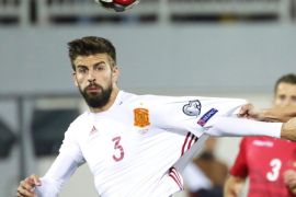 Albania's Ansi Agolli (R) in action against Spain's Gerard Pique (L) during the FIFA World Cup 2018 qualifying group G soccer match between Albania and Spain in Shkoder, Albania, 09 October 2016. Spain won 2-0.