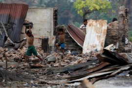 Children recycle goods from the ruins of a market which was set on fire at a Rohingya village outside Maugndaw in Rakhine state, Myanmar, October 27, 2016. Picture taken October 27, 2016. REUTERS/Soe Zeya Tun