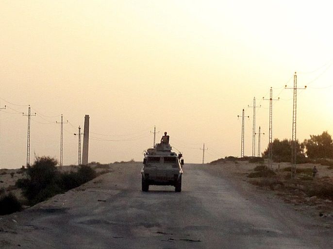 An Egyptian military vehicle is seen on the highway in northern Sinai, Egypt, in this May 25, 2015 file photo. To match Insight EGYPT-SINAI/INSURGENCY REUTERS/Asmaa Waguih/Files