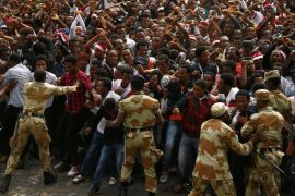 Demonstrators chant slogans while flashing the Oromo protest gesture during Irreecha, the thanksgiving festival of the Oromo people, in Bishoftu town, Oromiya region, Ethiopia, in this file photo taken October 2, 2016. REUTERS/Tiksa Negeri/File Photo