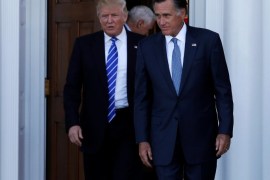 U.S. President-elect Donald Trump (L) and former Massachusetts Governor Mitt Romney emerge after their meeting at the main clubhouse at Trump National Golf Club in Bedminster, New Jersey, U.S., November 19, 2016. REUTERS/Mike Segar