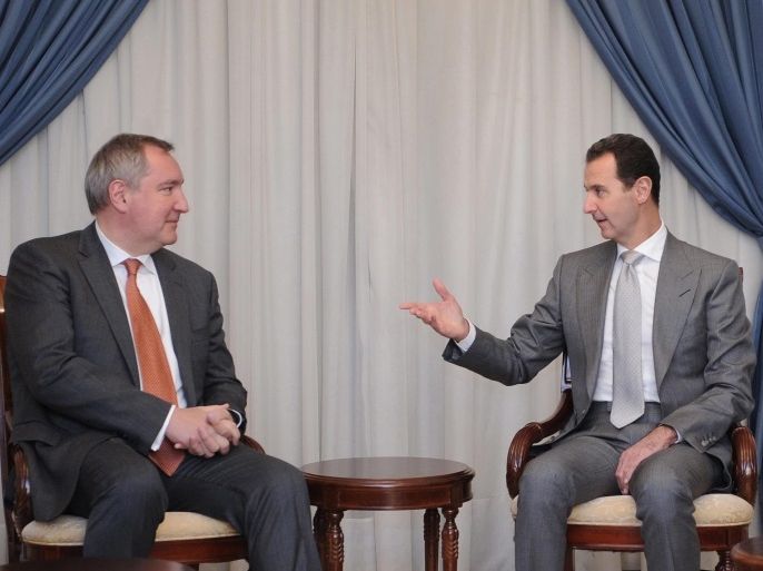 A handout photo released by Syria's Arab News Agency SANA shows Syrian President Bashar Assad (R) meeting with a Russian delegation head Russian Deputy Prime Minister Dmitry Rogozin, in Damascus, Syria, on 22 November 2016. According to media reports, Assad said that the policies and stands Russia espouses, either on the international level or regarding the terrorist war in Syria, 'have demonstrated Moscow’s normal location as a superpower.' EPA/SANA / HANOUT