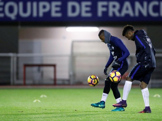 Football Soccer - France’s national soccer team training - World Cup 2018 Qualifiers - Domaine de Montjoye, Clairefontaine, France - 7/11/16. France's Patrice Evra and Kingsley Coman attend training ahead of their upcoming 2018 World Cup Group A qualifier match against Sweden. REUTERS/Gonzalo Fuentes