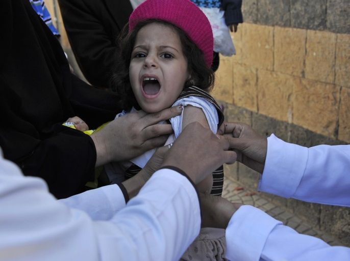 A Yemeni child reacts as she receives a measles vaccine at a health center in Sanaa, Yemen, 11 November 2014. Yemeni authorities launched a nine-day nationwide polio and measles immunization campaign targeting more than 11.6 million children and teenagers.