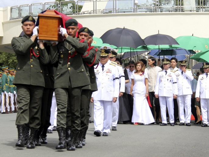 A handout picture dated and released on 18 November 2016 by the Office of the Army Chief Public Affairs Headquarters Philippine Army (OACPA HPA) shows Filipino soldiers carrying the flag-draped casket of the late Philippine dictator Ferdinand Marcos during burial rites at the Heroes' Cemetery in Pasay City, south of Manila, Philippines. Former Philippine dictator Ferdinand Marcos was buried at the Heroes' Cemetery in a controversial and unexpected ceremony, which was