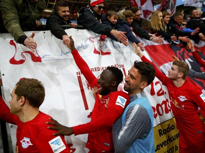 Football Soccer - Bayer Leverkusen v RB Leipzig - German Bundesliga - BayArena , Leverkusen, 18/11/16 Leipzig players with supporters after the match. REUTERS/Wolfgang Rattay DFL RULES TO LIMIT THE ONLINE USAGE DURING MATCH TIME TO 15 PICTURES PER GAME. IMAGE SEQUENCES TO SIMULATE VIDEO IS NOT ALLOWED AT ANY TIME. FOR FURTHER QUERIES PLEASE CONTACT DFL DIRECTLY AT + 49 69 650050