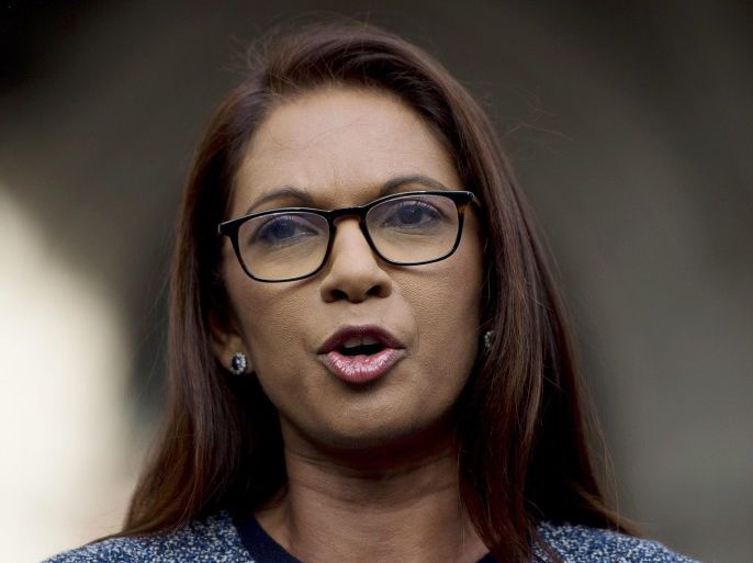 Lead claimant in the Article 50 case, Gina Miller (C), gives a statement outside of the High Court after a decision ruling in her landmark lawsuit in London, Britain, 03 November 2016. In a major blow for Britain's government, the High Court has ruled that the prime minister can't trigger the UK's exit from the European Union without approval from Parliament.