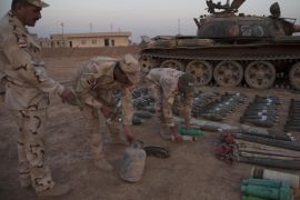 Iraqi army organize mortar shells and bombs and tanks confiscated from IS, at Gogjeli district in Mosul, northern Iraq, 07 November 2016.