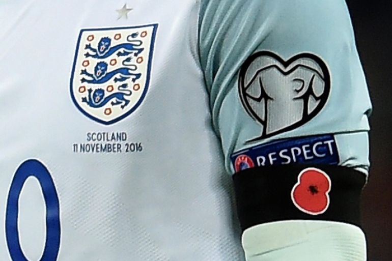 England's captain Wayne Rooney wears a black armband with a poppy during the FIFA World Cup 2018 Qualification group F match between England and Scotland at Wembley Stadium in London, Britain, 11 November 2016. Rooney and his England teammates wore black armbands featuring a remembrance poppy, despite a FIFA ban. The poppy is an artificial flower that is used to commemorate military personnel who have died in war.