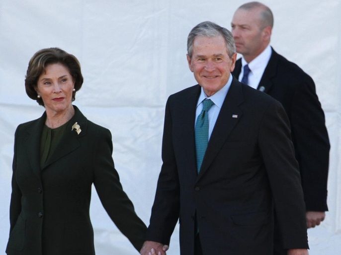 (L-R) Former US First Lady Laura Bush and former US President George W. Bush walk out before the President of the United States Barack Obama speaks during activities commemorating the 50th anniversary of the Bloody Sunday crossing of the Edmund Pettus Bridge in Selma, Alabama, USA, 07 March 2015. The weekend of civil rights activities also honors the Selma-to-Montgomery March and the Voting Rights Act of 1965.