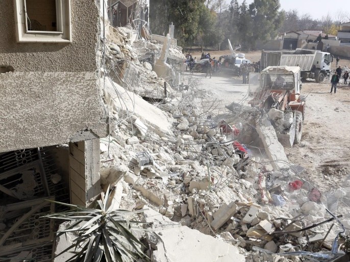 Rescuers work at the site of collapsed residential building following an air strike in which Hezbollah member Samir al-Qantar was killed, in the south of Jaramana city, Damascus countryside, Syria, 20 December 2015. Lebanese Shiite militia of Hezbollah said on 20 December that Samir Qantar, who became a Hezbollah member after he was jailed in Israel for a deadly 1979 raid, was assassinated in an Israeli airstrike on the outskirts of the Syrian capital of Damascus.