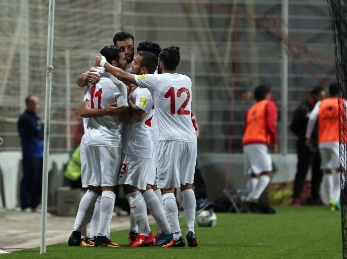 Tunisian players celebrate a goal during the FIFA World Cup 2018 qualifying soccer match between Libya and Tunisia at Omar-Hamadi Stadium in Algiers, Algeria, 11 November 2016.
