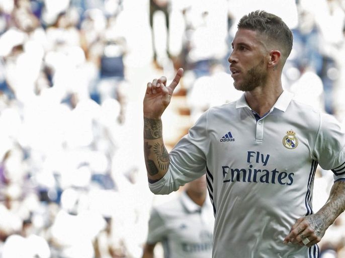 Real Madrid's Sanish defender Sergio Ramos celebrates after scoring against Osasuna during the Spanish primera Division soccer match played against Osasuna at Bernabeu stadium in Madrid, Spain, 10 September 2016.