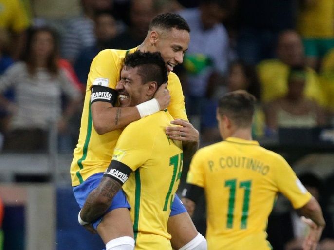 Football Soccer - Brazil v Argentina - World Cup 2018 Qualifiers - Mineirao stadium, Belo Horizonte, Brazil - 10/11/16 - Brazil's Paulinho (C) celebrates with teammate Neymar after scoring his goal against Argentina. REUTERS/Cristiane Mattos FOR EDITORIAL USE ONLY. NO RESALES. NO ARCHIVES