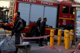 Israeli firefighters clean the scene where a Palestinian, who the Israeli military said tried to stab a soldier, was shot dead by Israeli troops near the Jewish settlement of Ofra near the West Bank city of Ramallah November 3, 2016. REUTERS/Ammar Awad